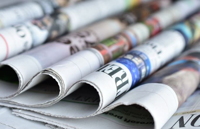 Ringmer u3a What the papers say group image of a horizontal pile of newspapers