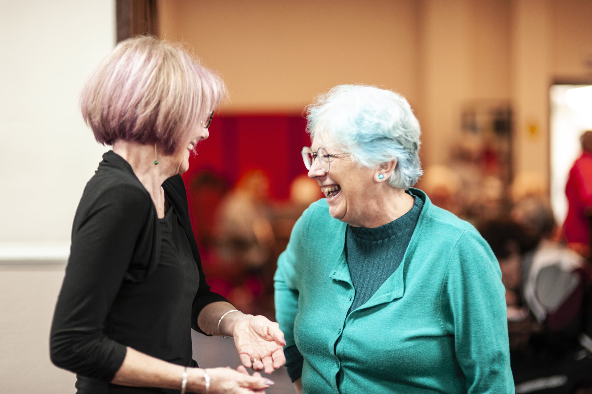 two women meeting and laughing